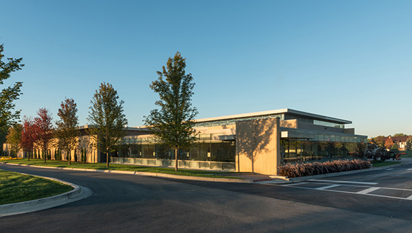 Decorative concrete and glass give the Campus Maintenance Center an attractive face toward the College of DuPage campus. Less exposed areas use a more economical precast.