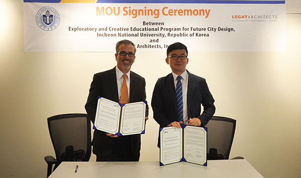 Legat Architects’ President/CEO Patrick Brosnan and Incheon National University assistant professor/former Legat employee Jinho Kim celebrate a Memorandum of Understanding.