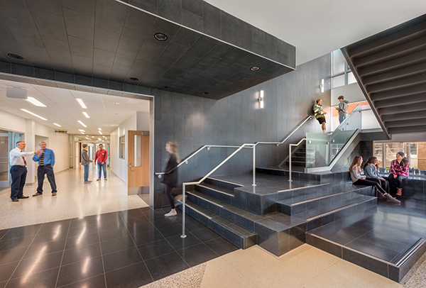 A monumental stair connects all three levels of the expansion.