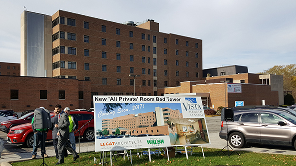 A large sign announces the project to passersby on Sheridan Road.