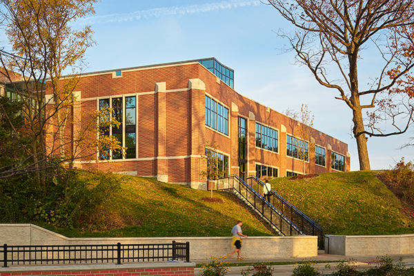 The addition, built into the side of a hill, respects the Collegiate Gothic architectural style of the original facility.