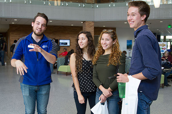 CLC Enrollment Services Student Ambassador Rick Seng shows prospective students the revamped student life spaces.