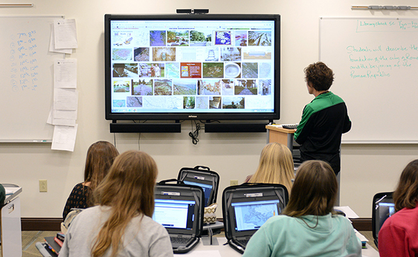 In the LaSalle-Peru High School Model Classroom, teacher Kristen Adams uses a device much like a wall-sized iPad to engage one section of her World History class.