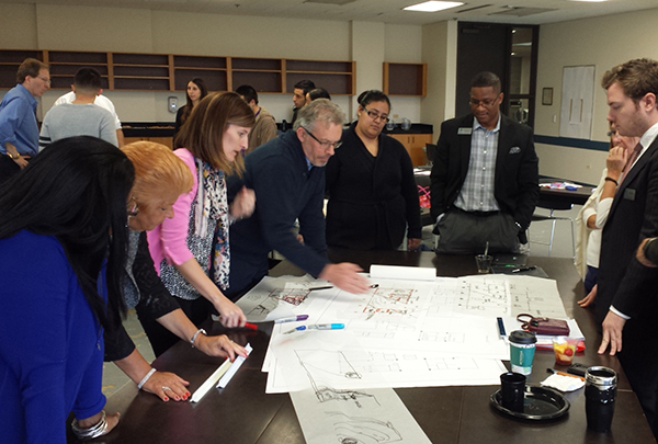 Students, staff, architects and interior designers explore options during a design charrette.