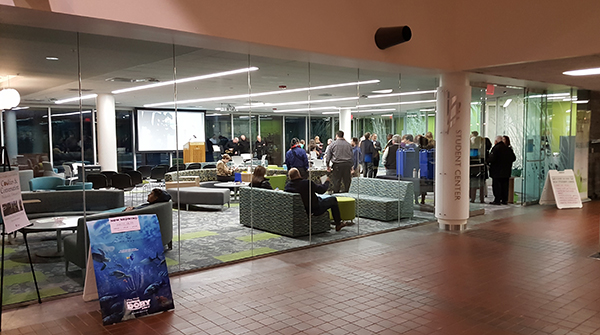 Floor-to-ceiling glass walls display the Student Center to those passing in the corridor. During the day, the glass walls at the back of the center showcase the Oakton campus.