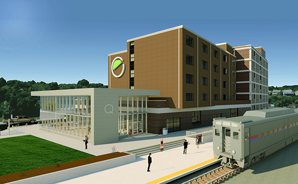“The Q” mixed-use development in Moline, Illinois. A new promenade resolves a four-foot grade separation by creating an accessible walkway between the multimodal station/hotel and the platform. 