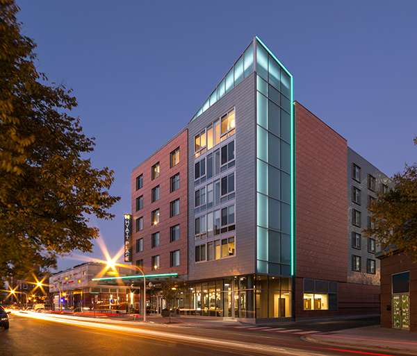 The zinc shingle and porcelain tile façade respects the community’s historic context, while creating a transition to the more modern design vocabulary of Harper Court.