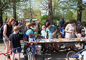 students with bikes at an outdoor event