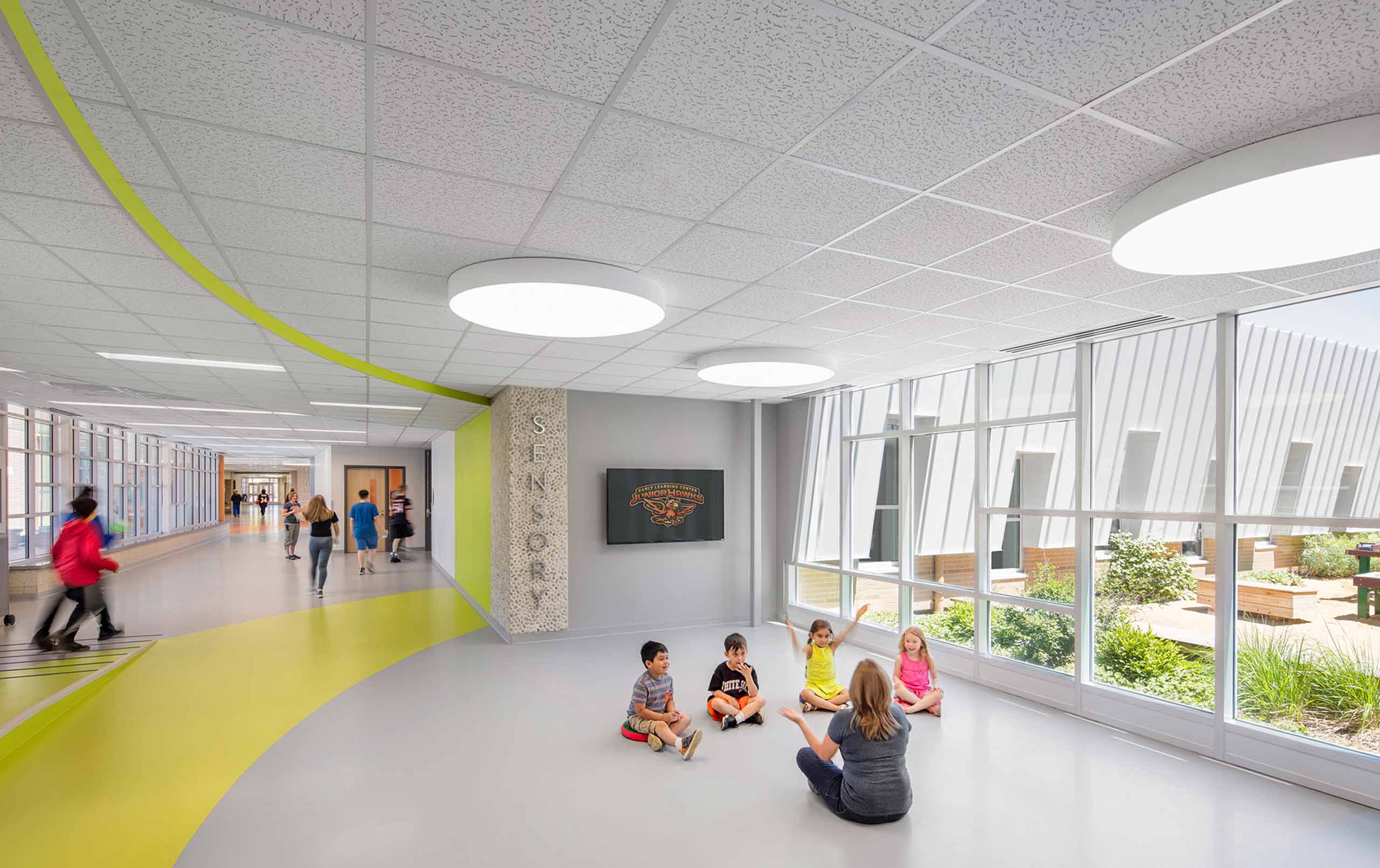 Students interacting with teacher in CCSD59 Early Learning Center corridor 