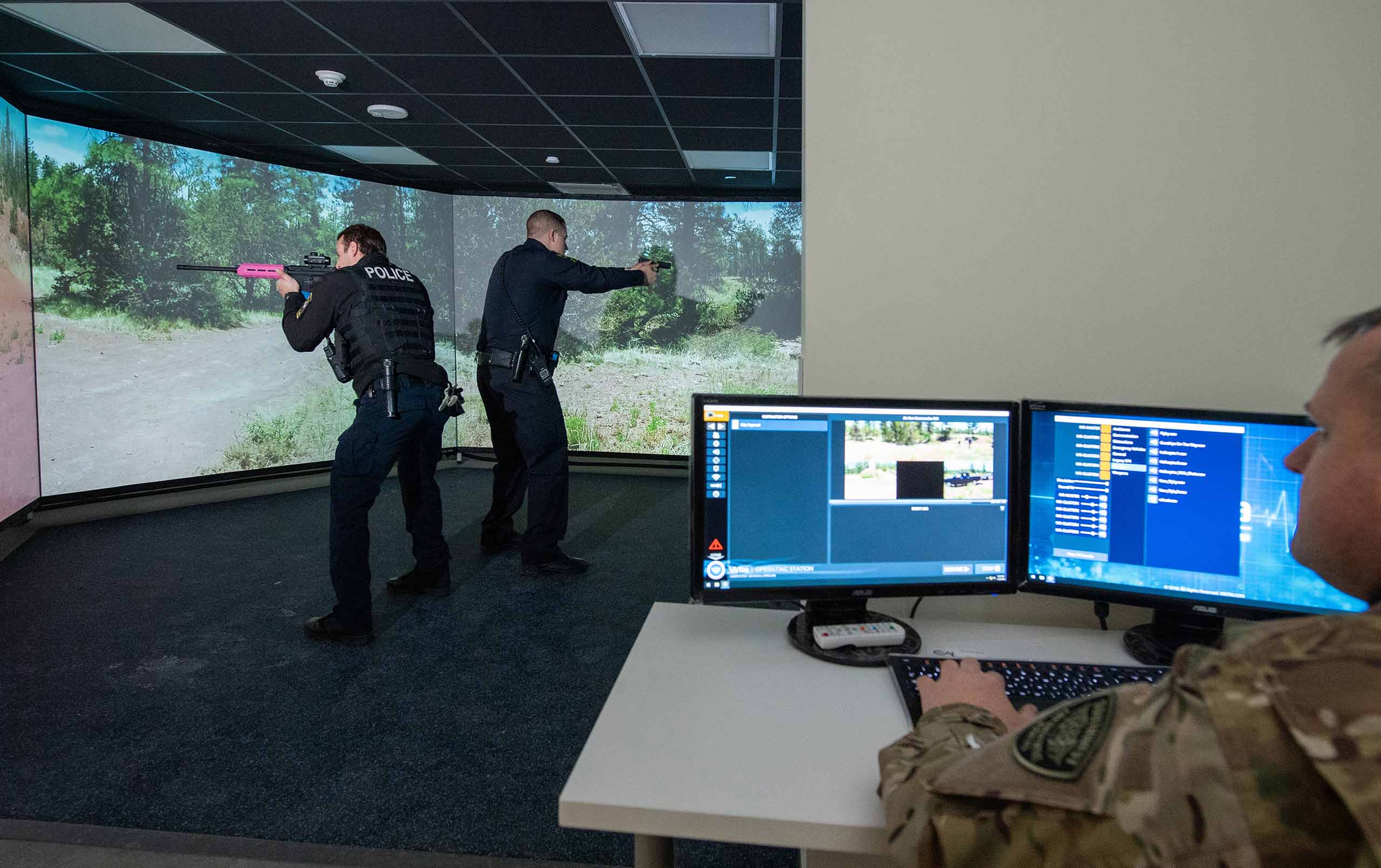 Two officers training with VirTra V-300 Firearms Training Simulator 