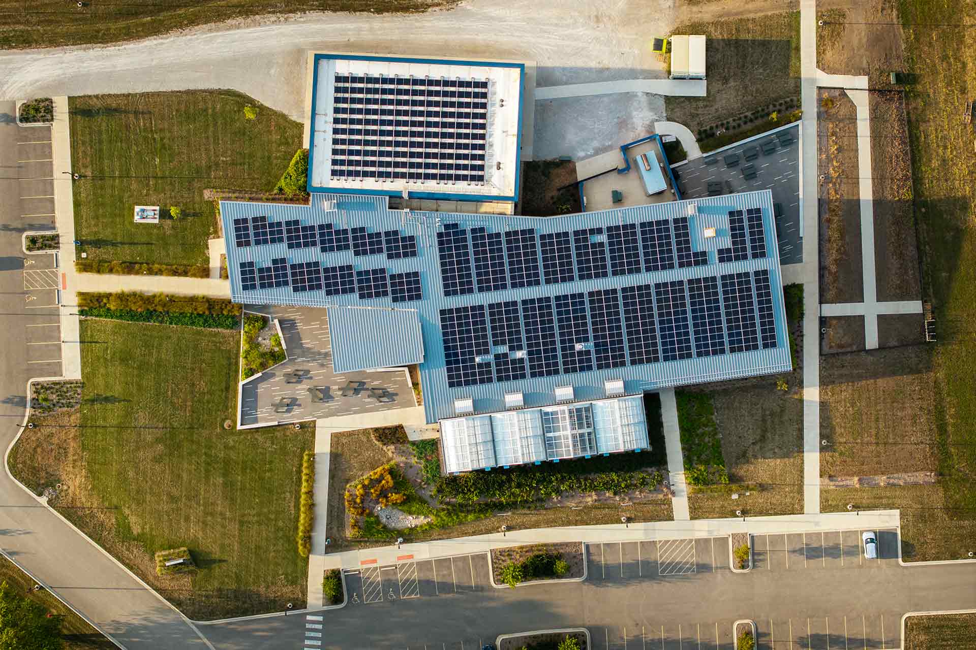 aerial view of college facility with rooftop solar panel array
