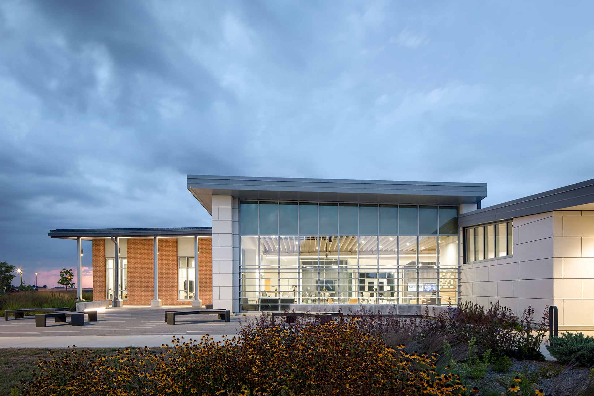 dusk shot looking through glass wall into community college lobby