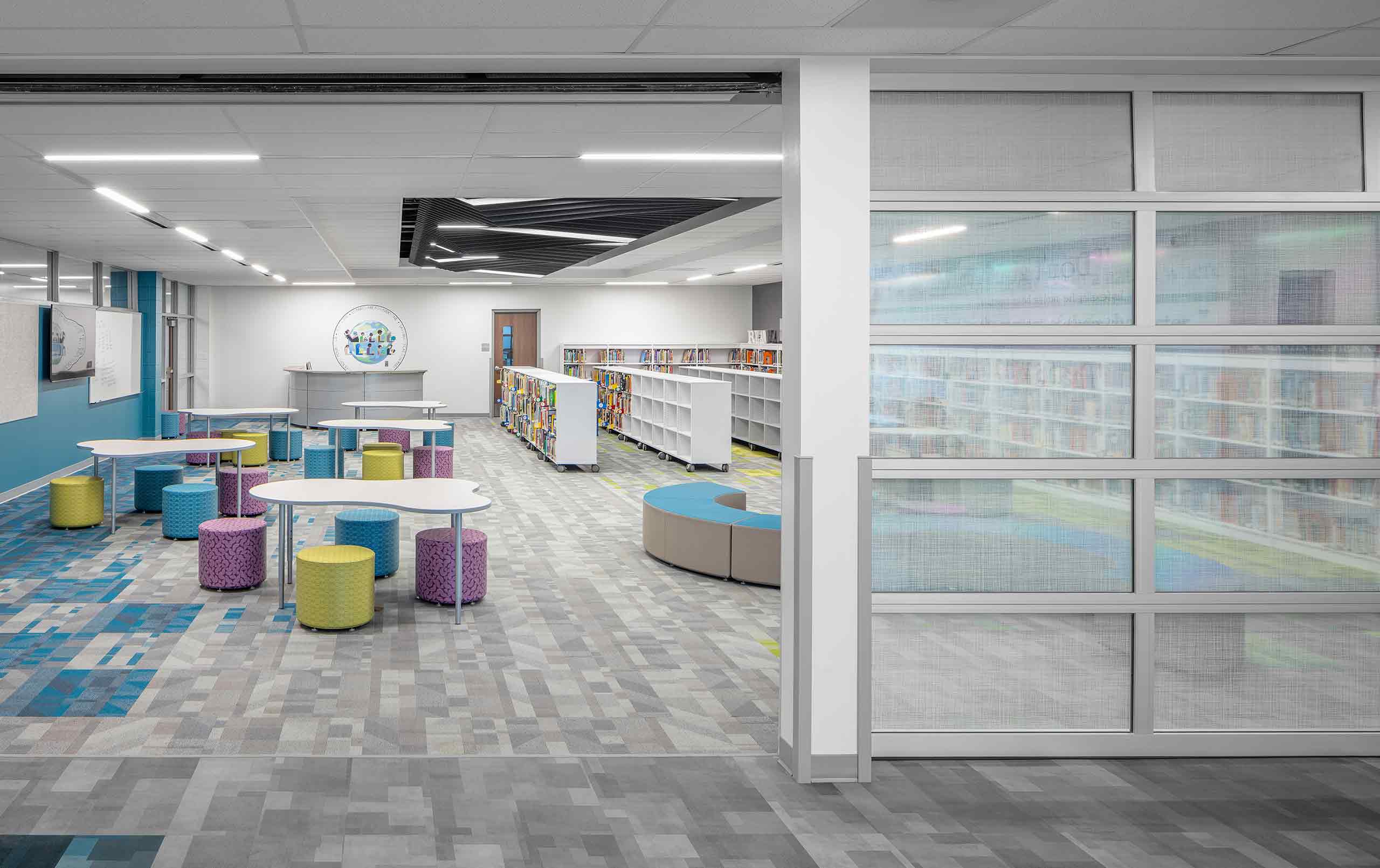 Galesburg King Elementary School library with seating, tables, and bookshelves