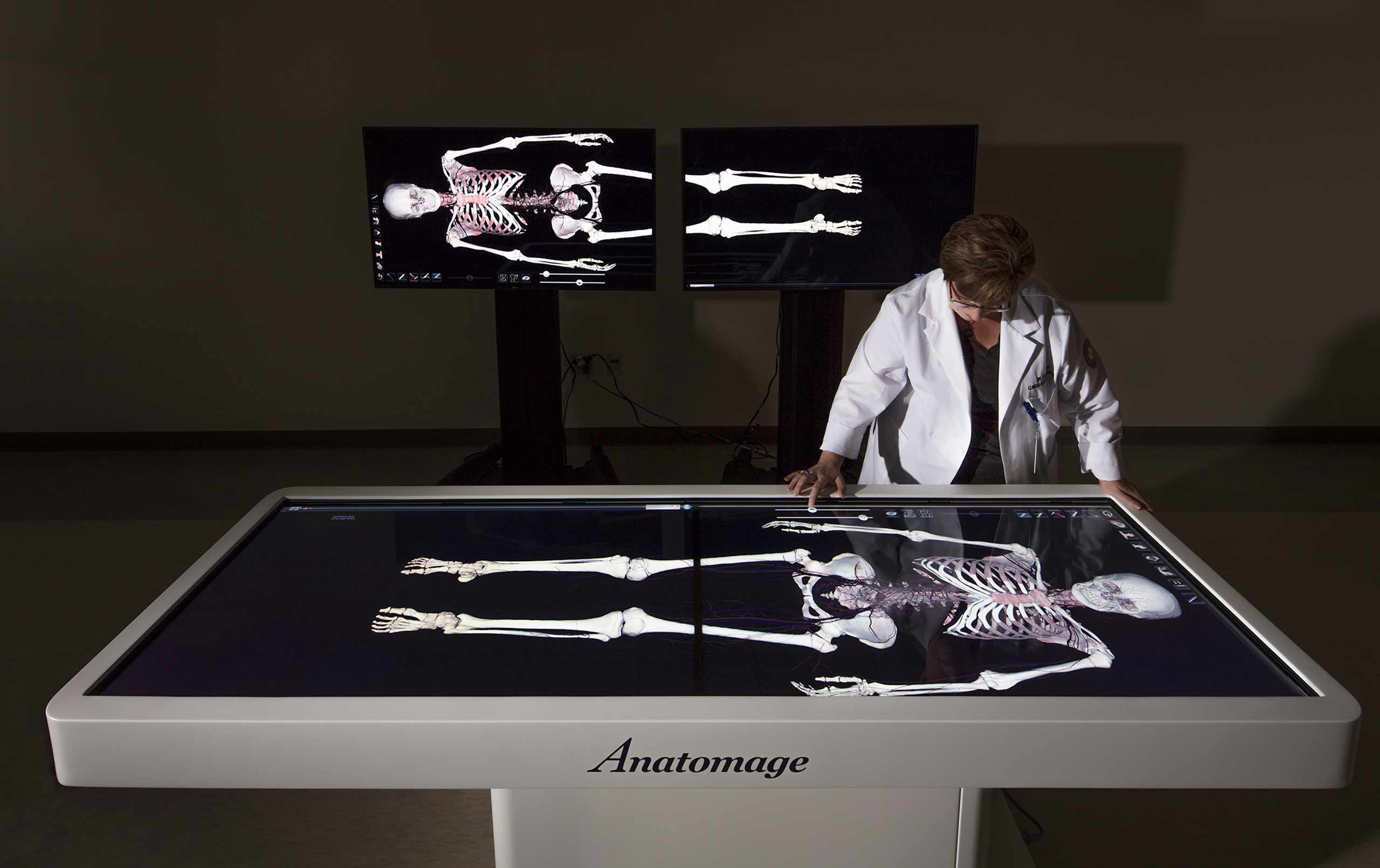 Doctor examining simulated autopsy table at Rosalind Franklin University Center for Advanced Simulation in Healthcare