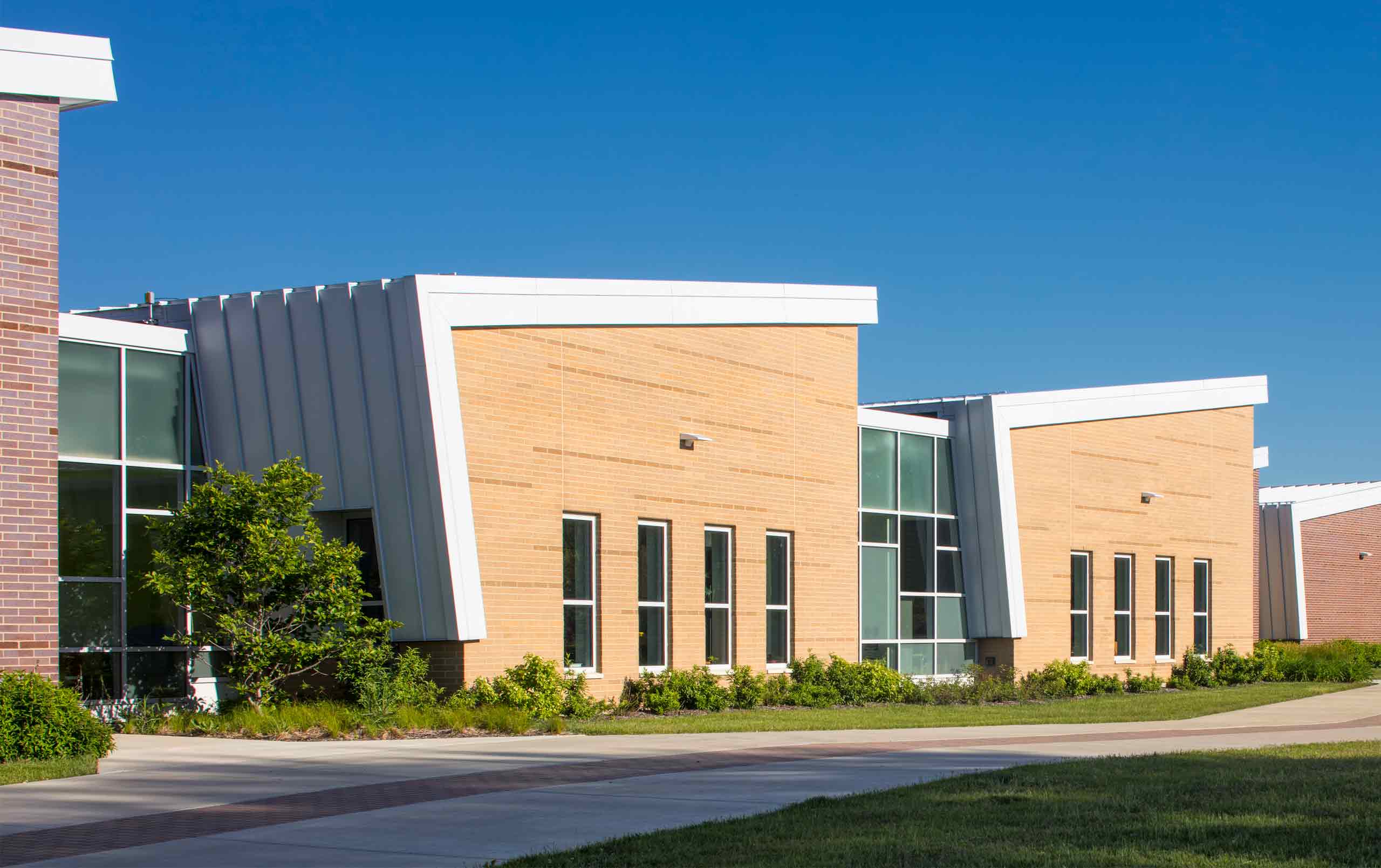 CCSD 59 Early Learning Center exterior featuring brick facades and sloping metal roofs