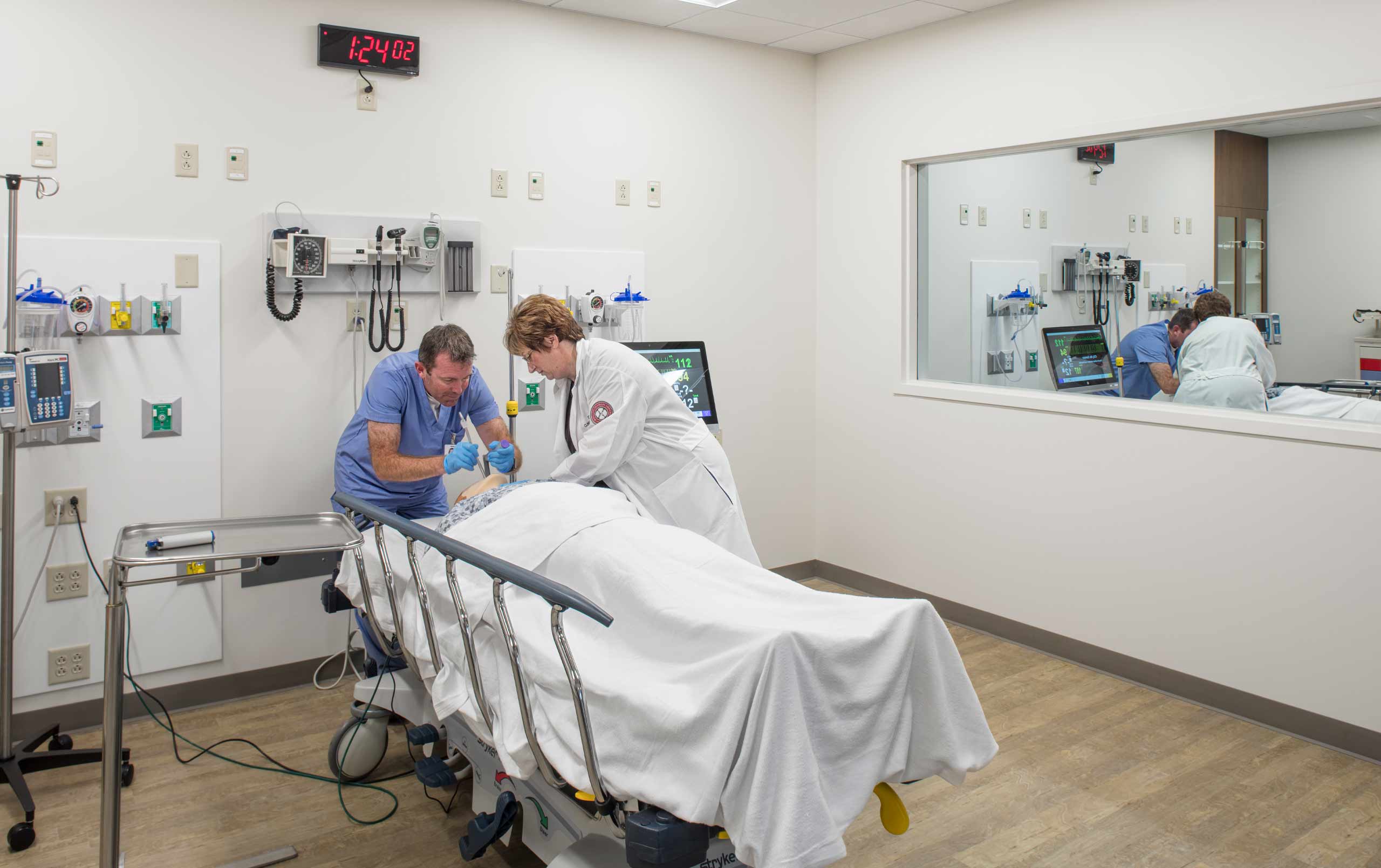 Doctors work on mannequin at Rosalind Franklin University Center for Advanced Simulation in Healthcare