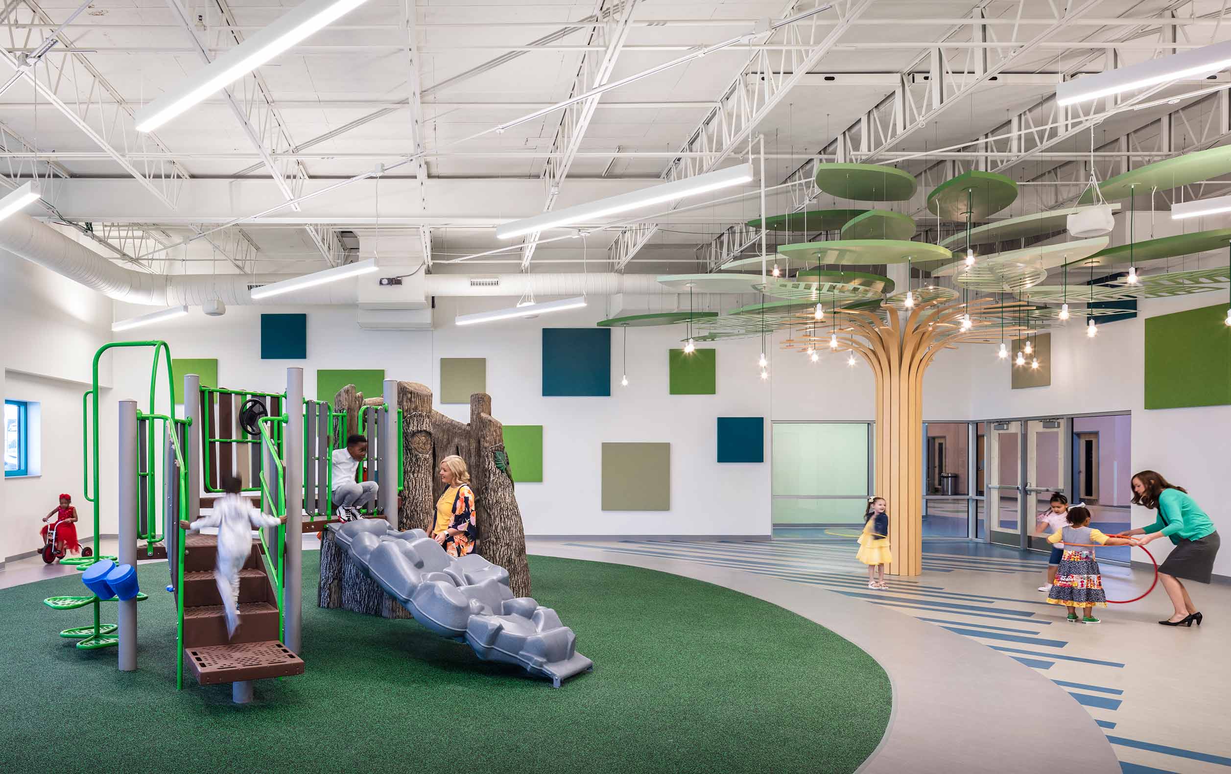 Preschool children playing on indoor playground