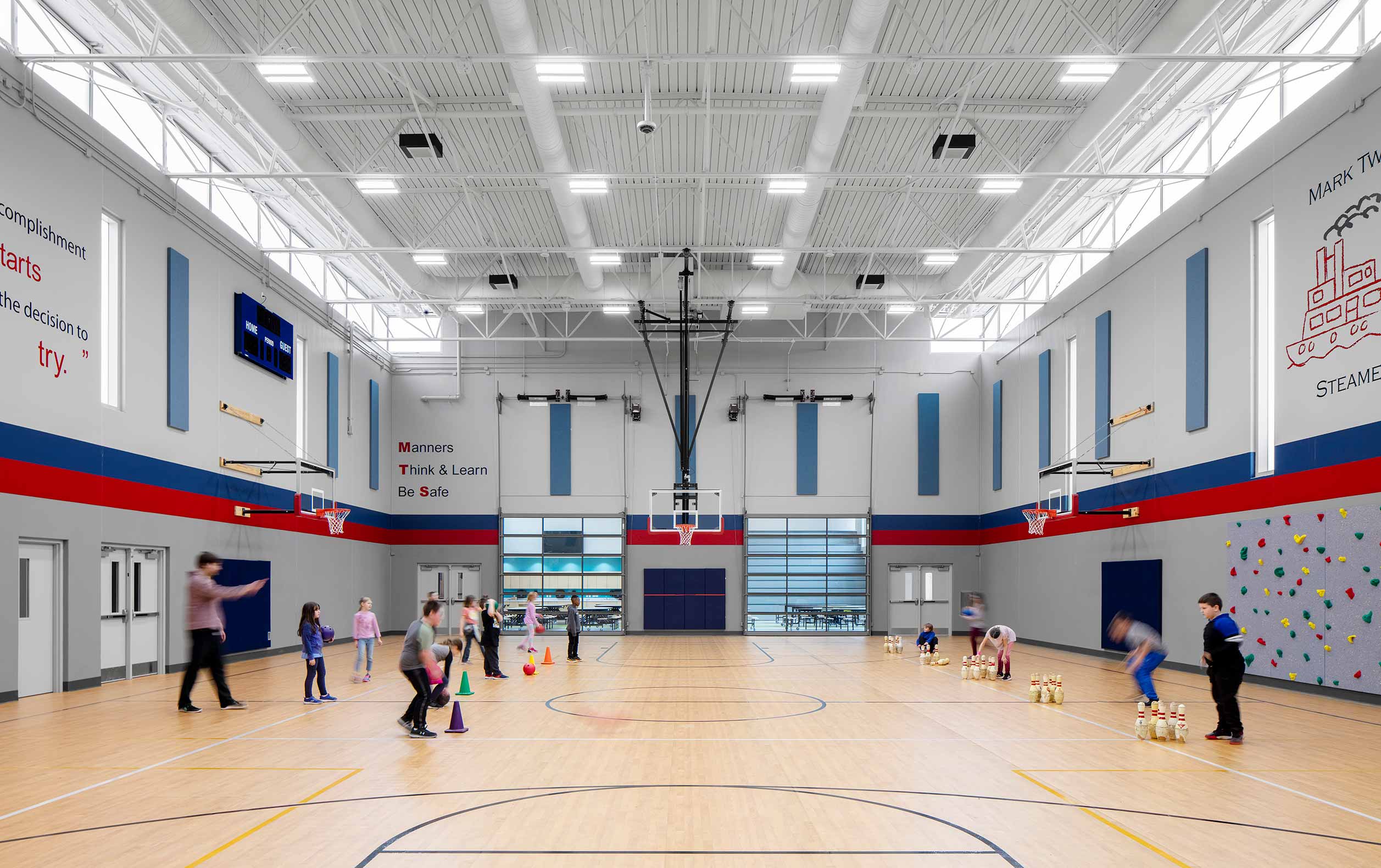 Students playing game in gymnasium