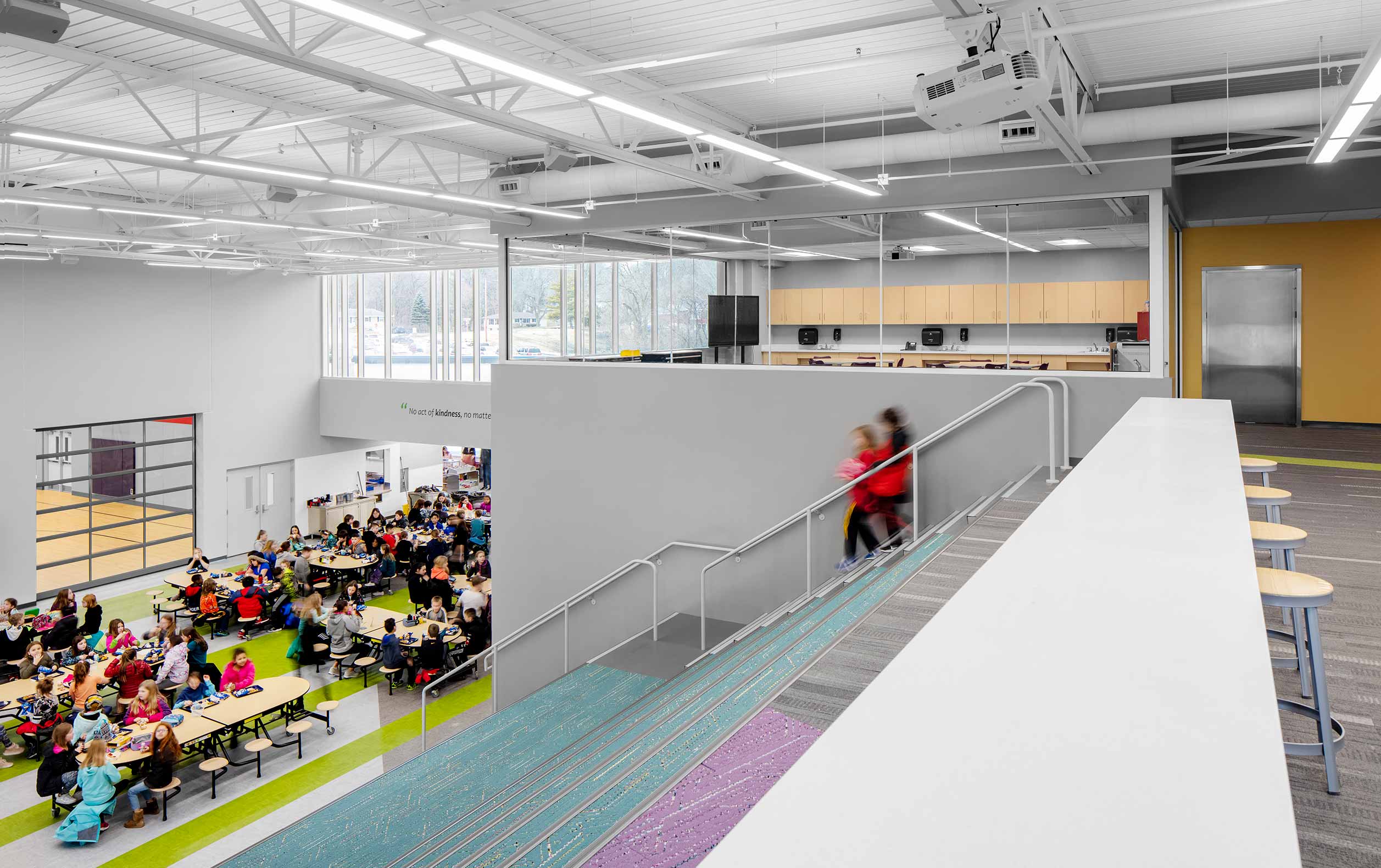 School staircase looking down on cafeteria with students