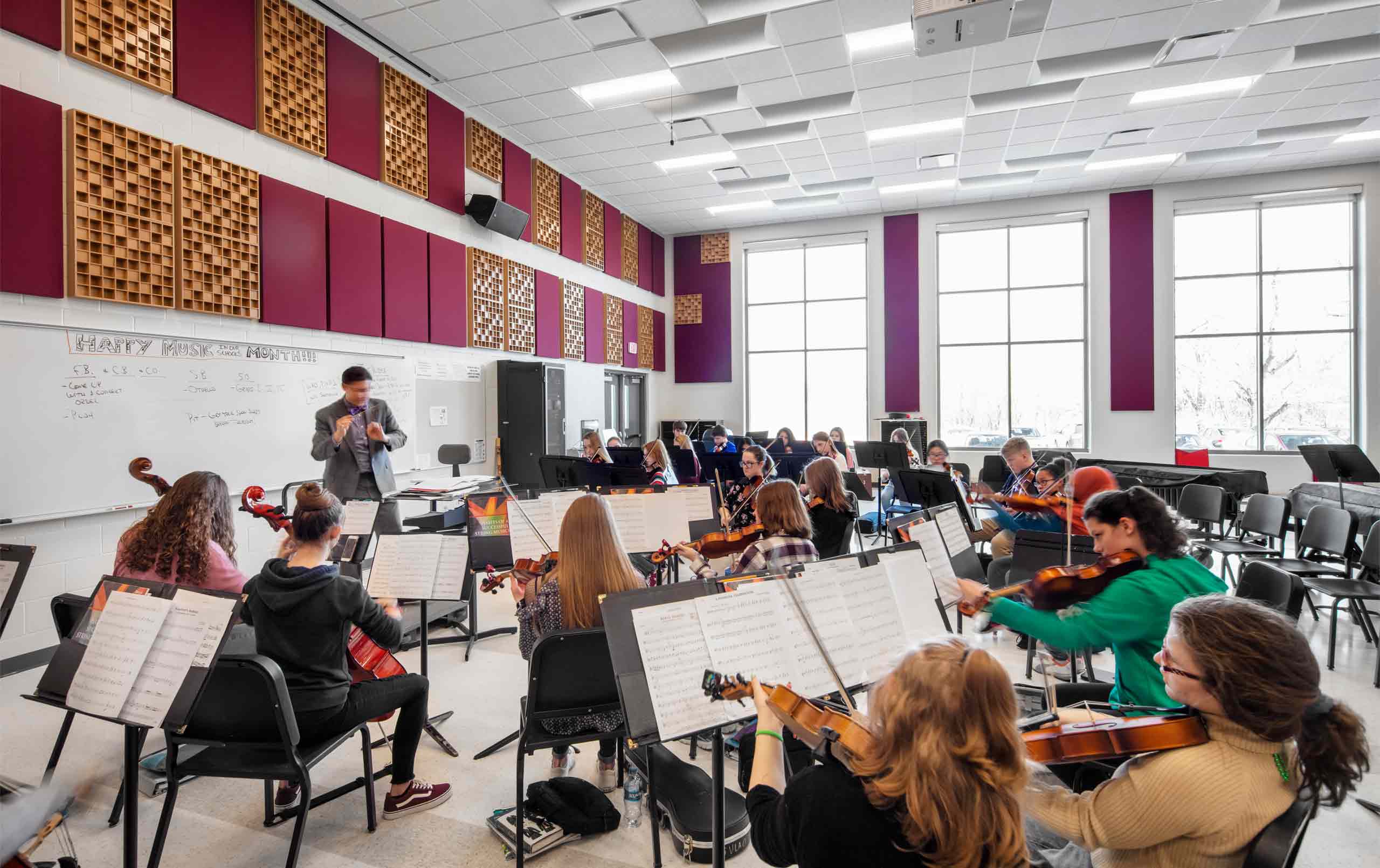 Moline High School band room with students practicing