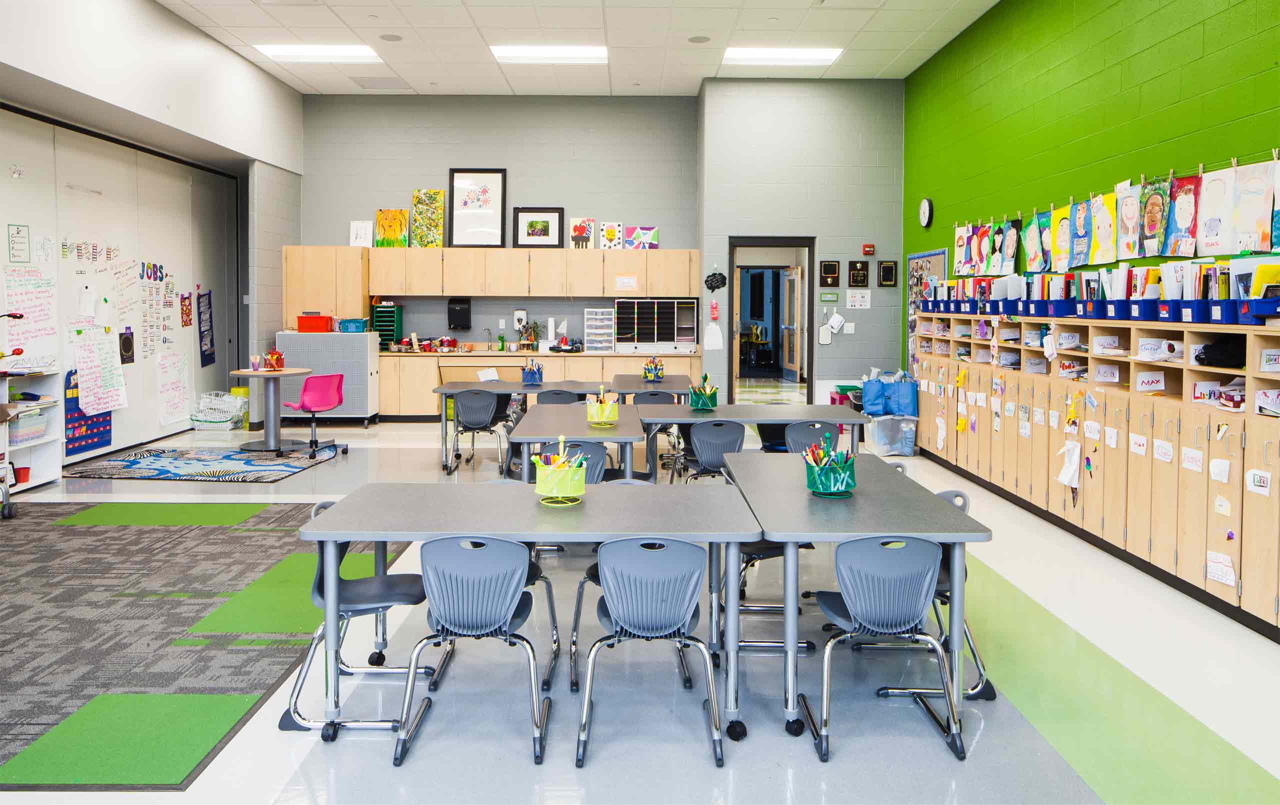 Elementary school classroom with green wall and flooring