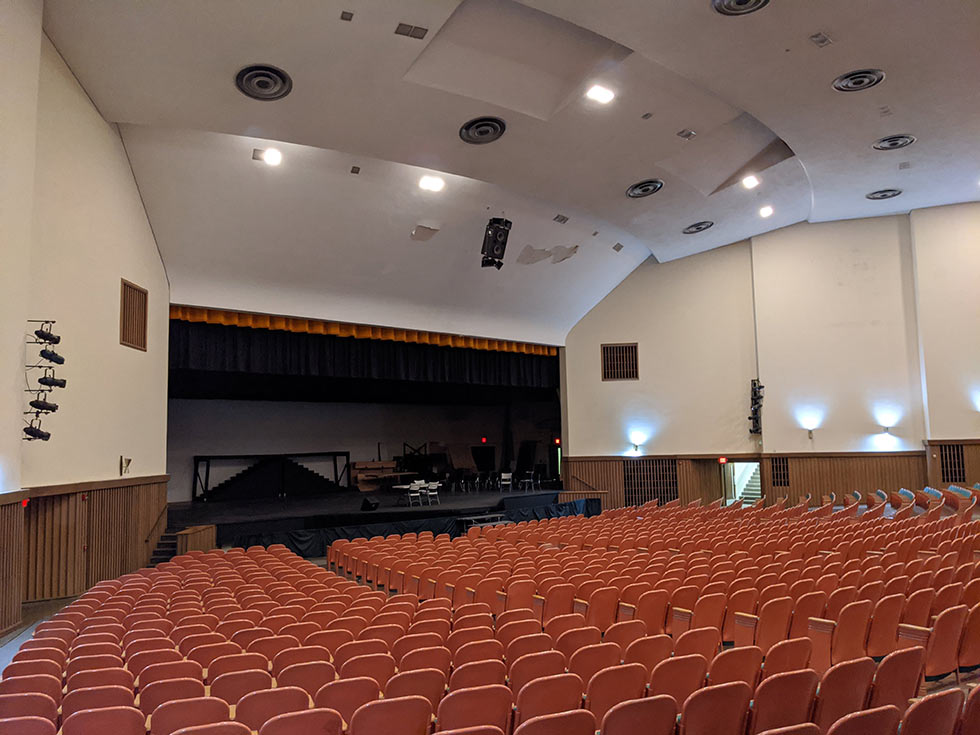 View of old theater from back seats toward stage.