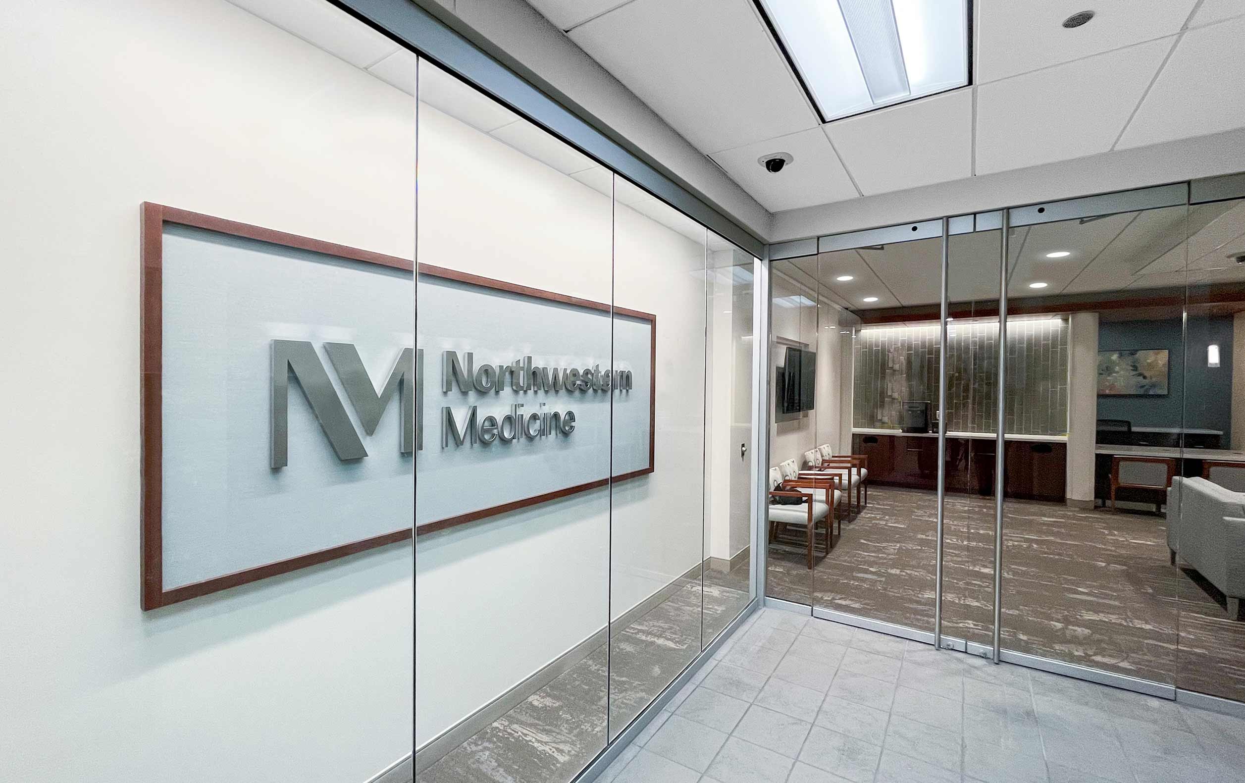 medical office space entry: Northwestern Medicine sign behind glass wall