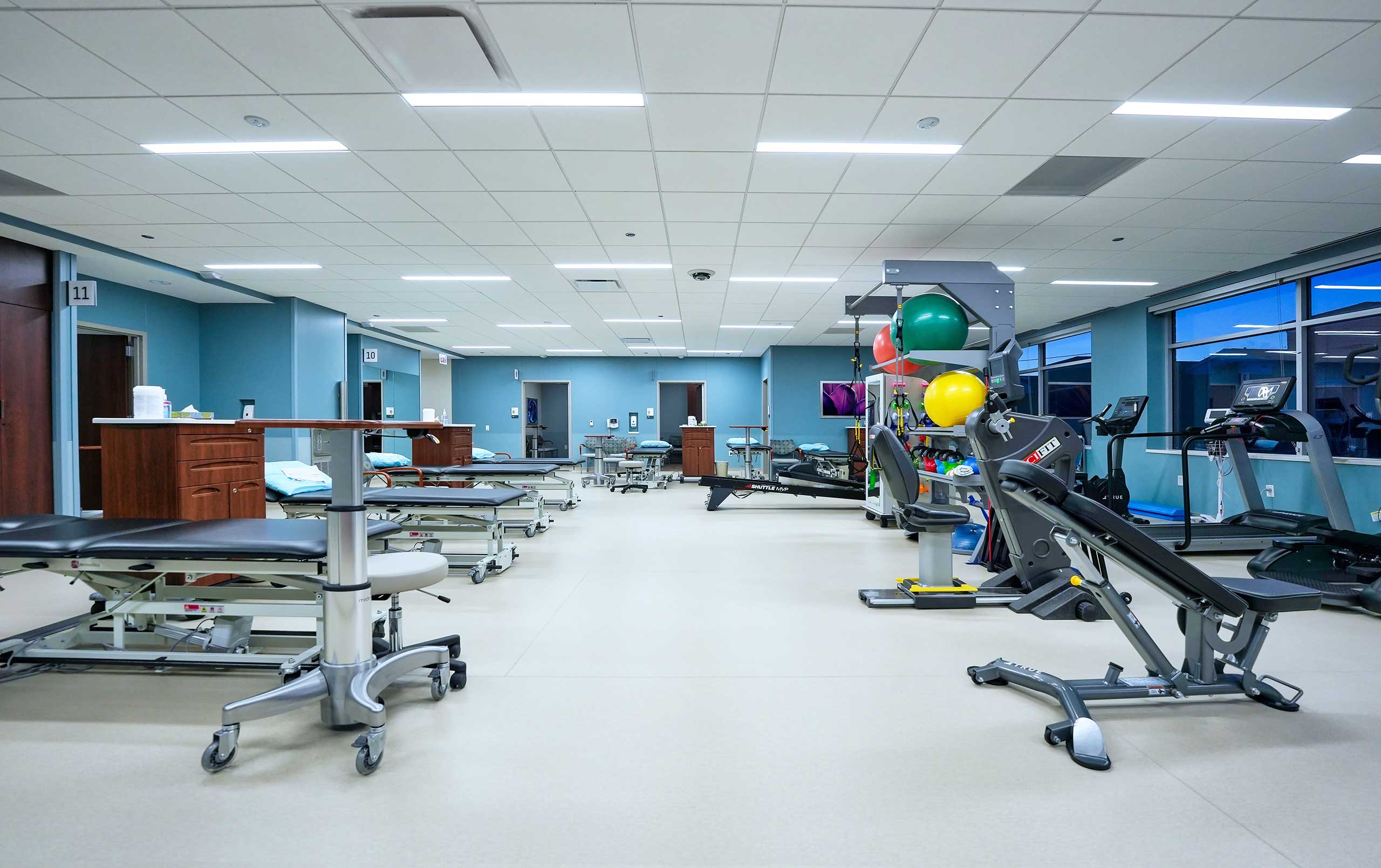 Medical office building physical therapy room with equipment