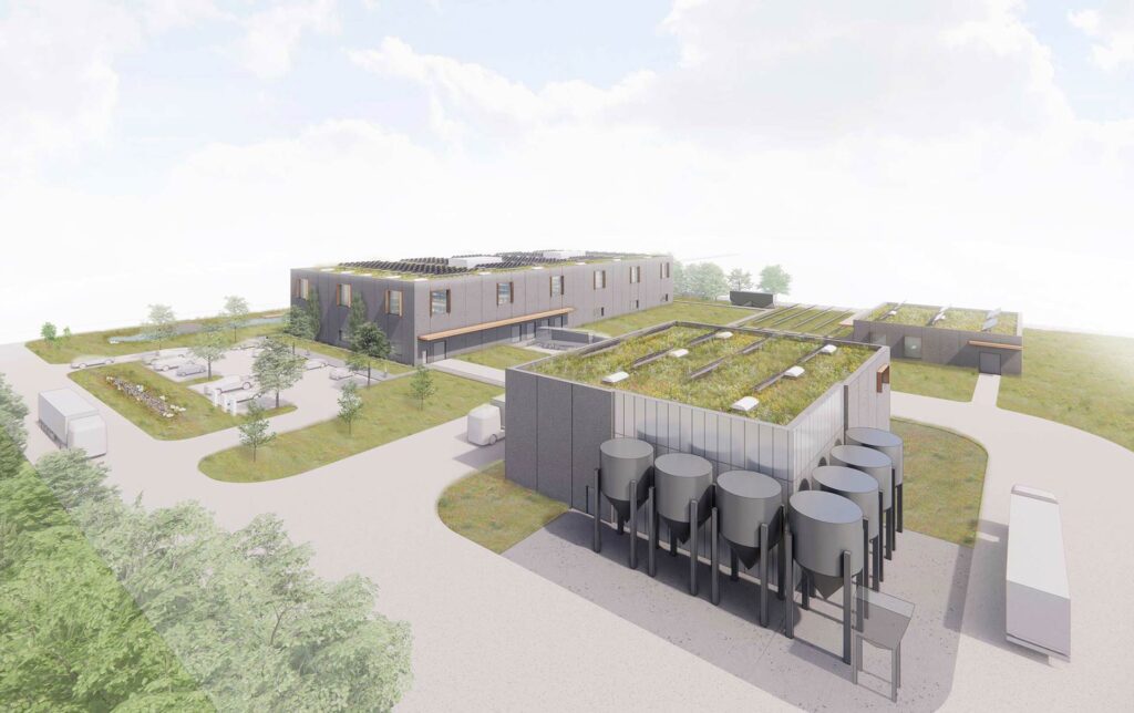 Rendering of manufacturing buildings with green roofs, rainwater harvesting systems, and other sustainable features
