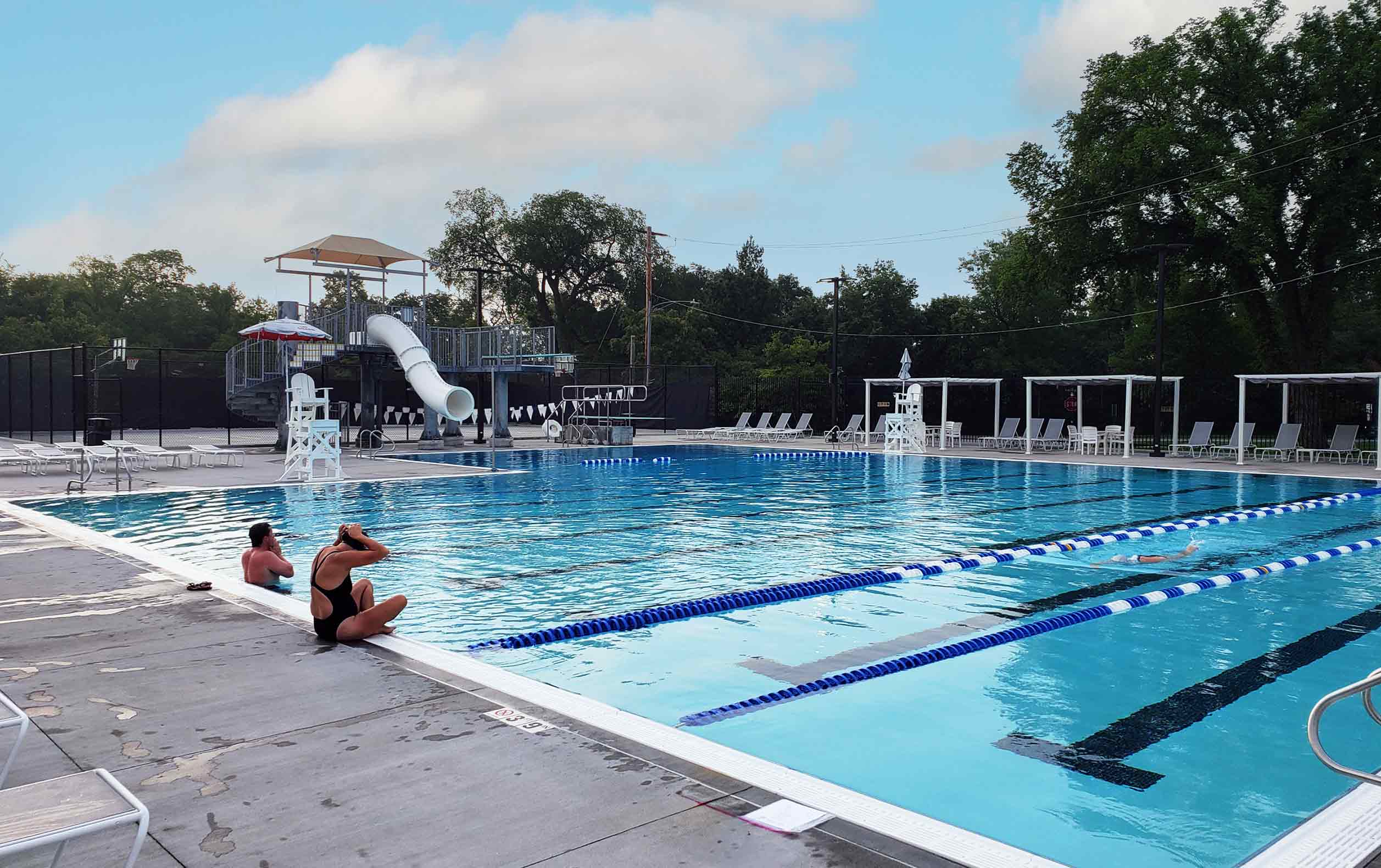Riverside Swim Club main pool with waterslide and diving boards