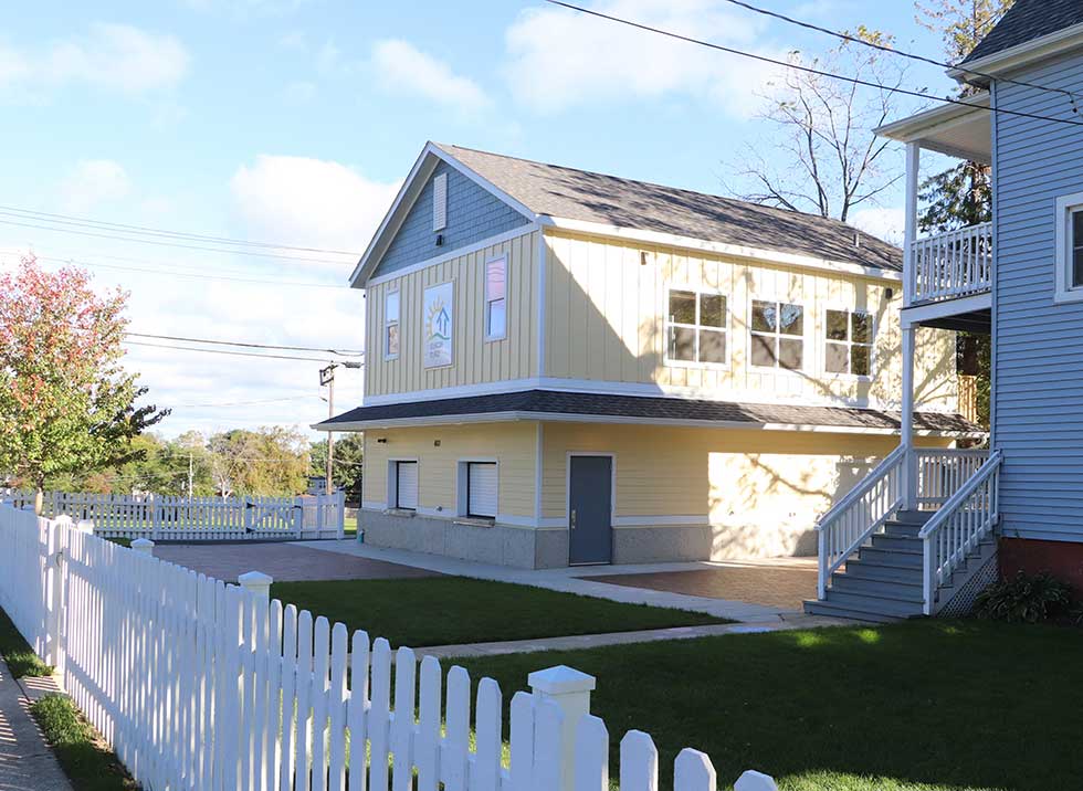 Exterior view of yellow Beacon Place in Waukegan, Illinois