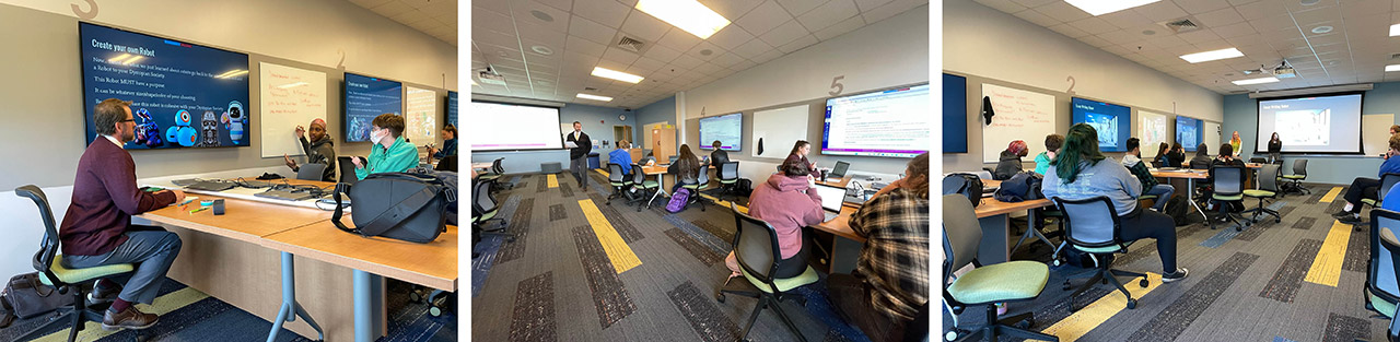 Professor talking with students in, professor walking around classroom with bright flooring and multiple wall monitors, and students presenting in classroom