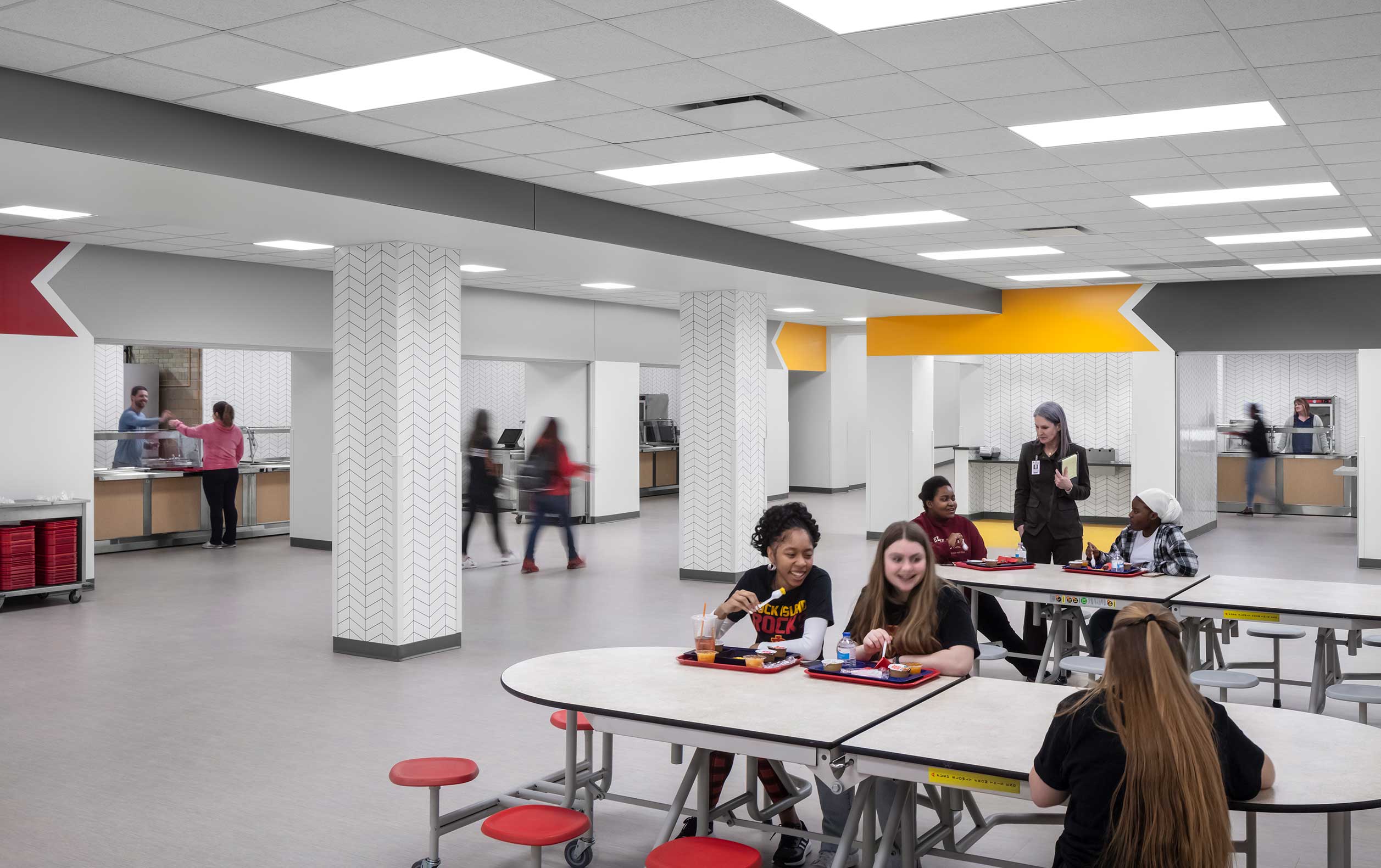 Students eating in cafeteria with red and yellow highlights