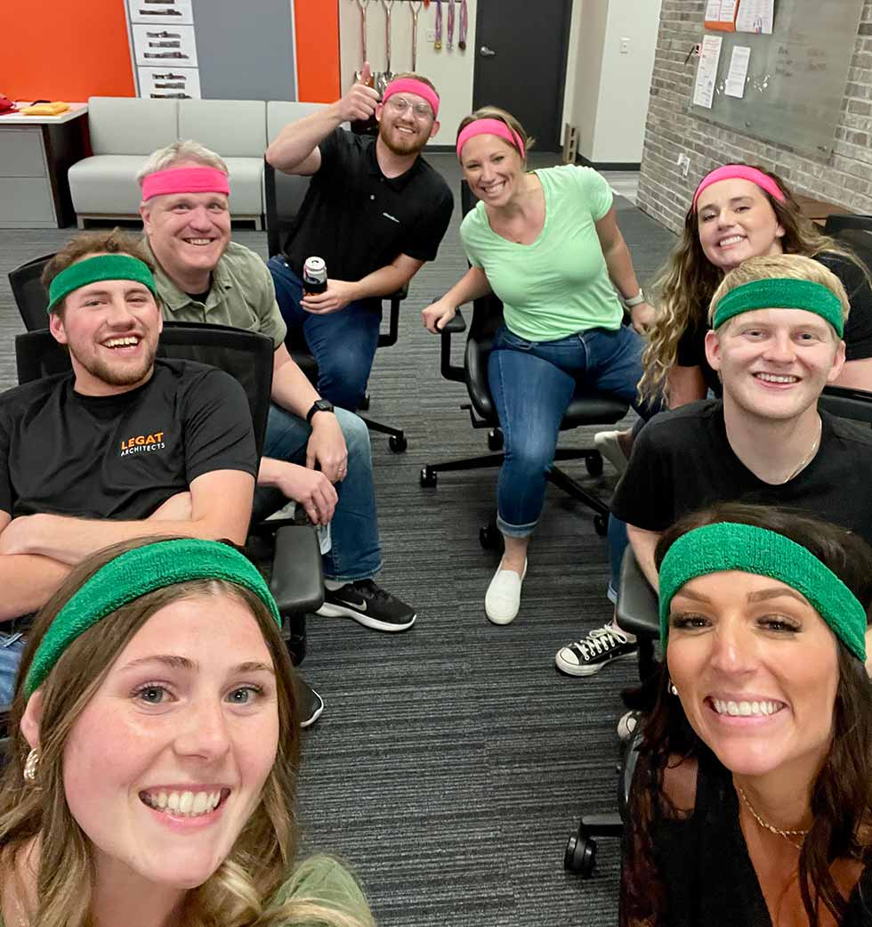 Architectural team members wearing headbands and smiling