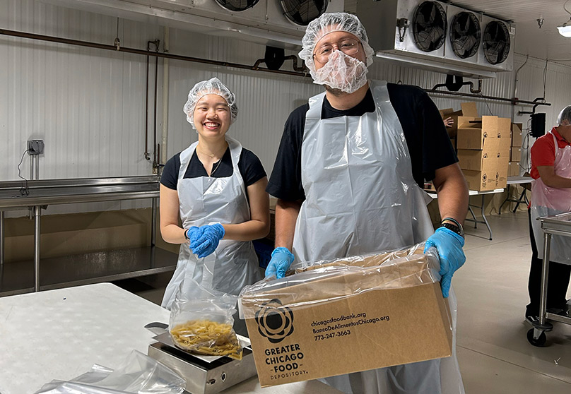 Architects packing food for charity