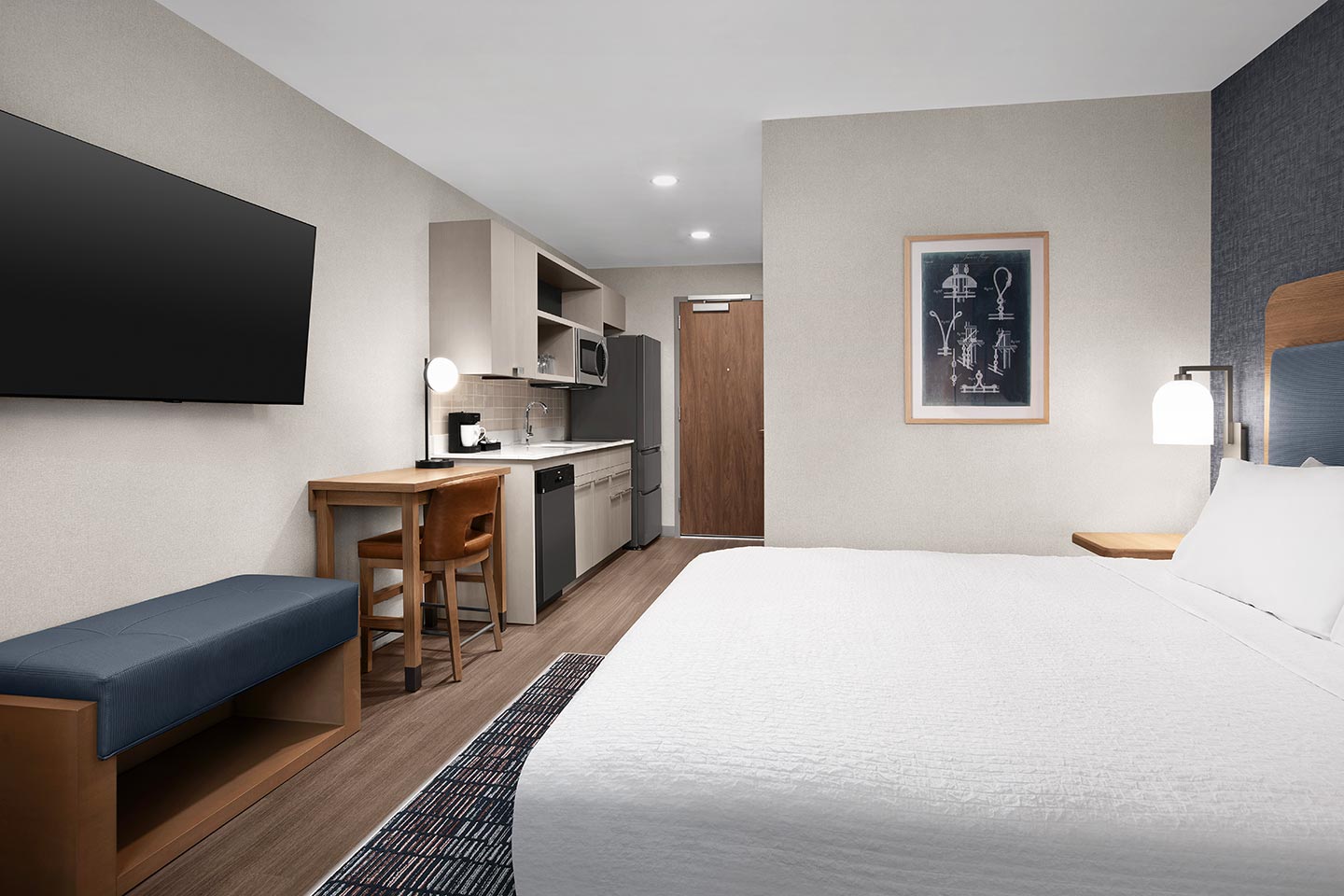 Hotel suite with king-size bed and artwork