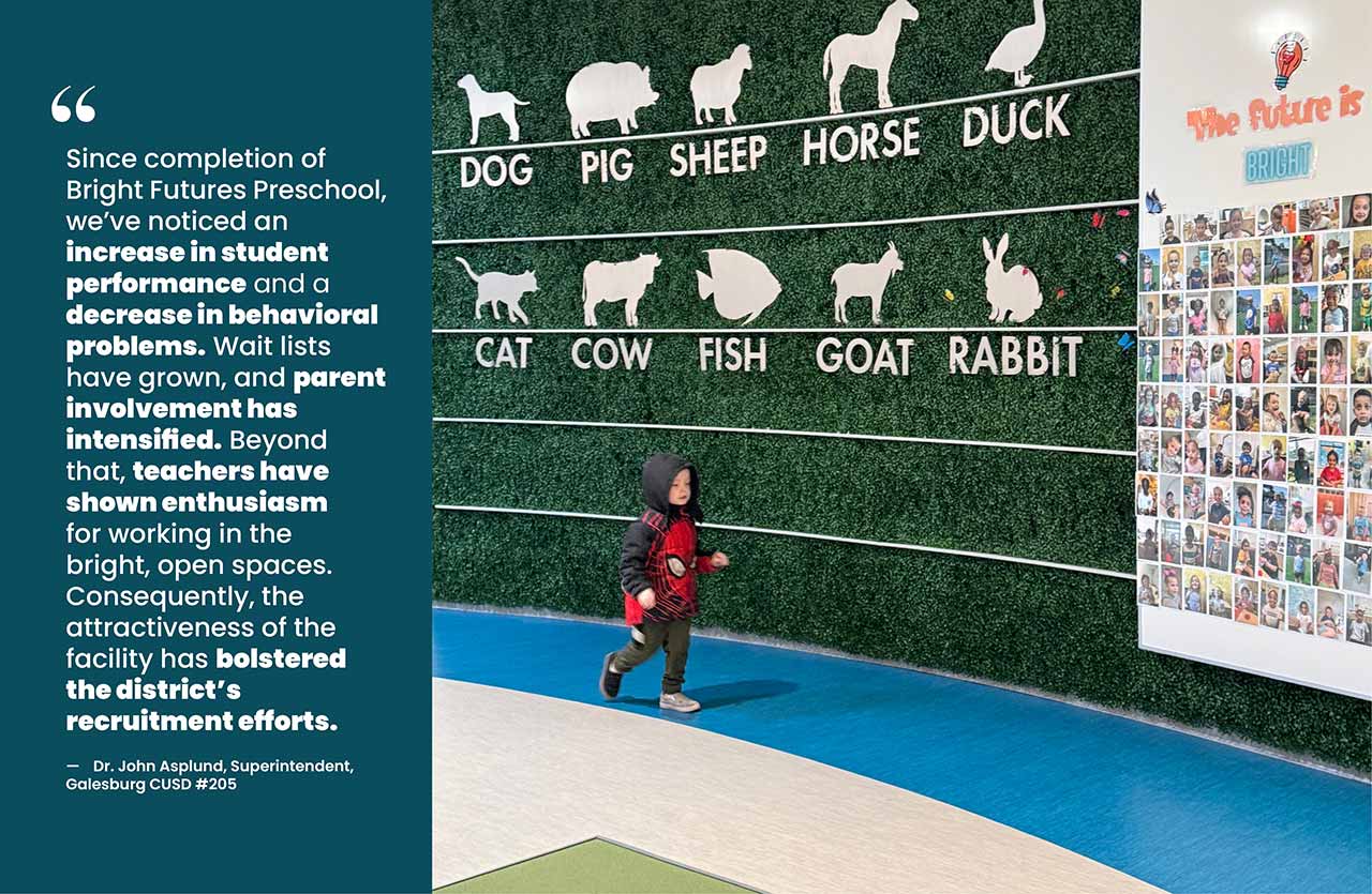 Excited early learning student walking in front of vegetated wall with different animals