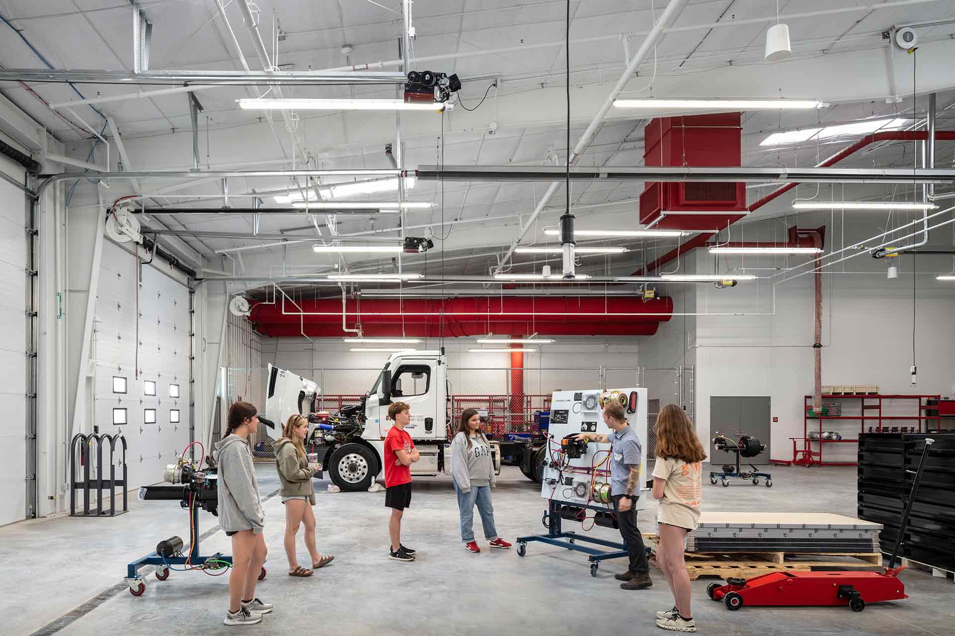 high school students getting lesson in diesel tech lab