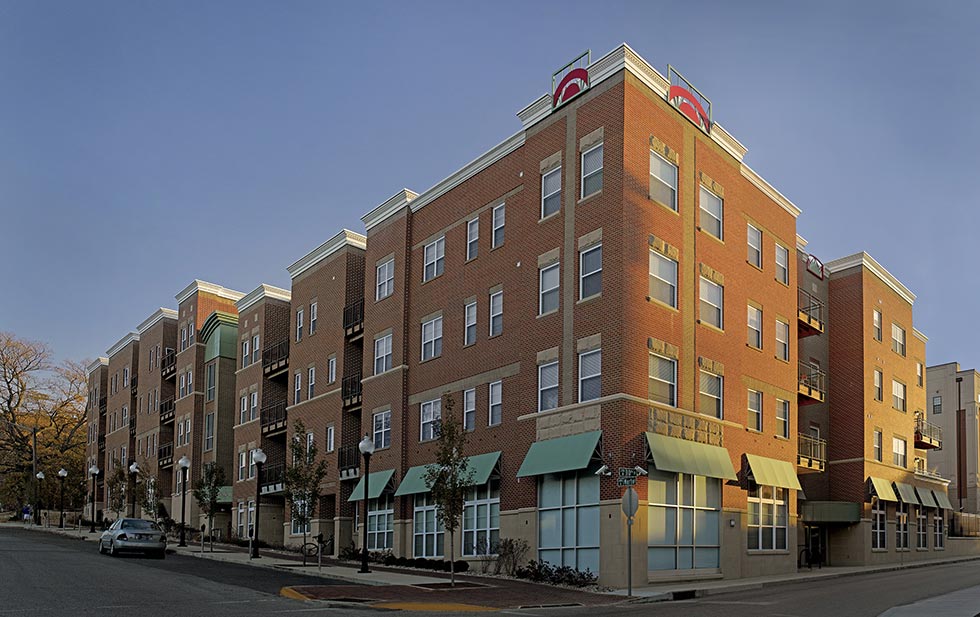 Exterior view of university student living building with retail on first floor