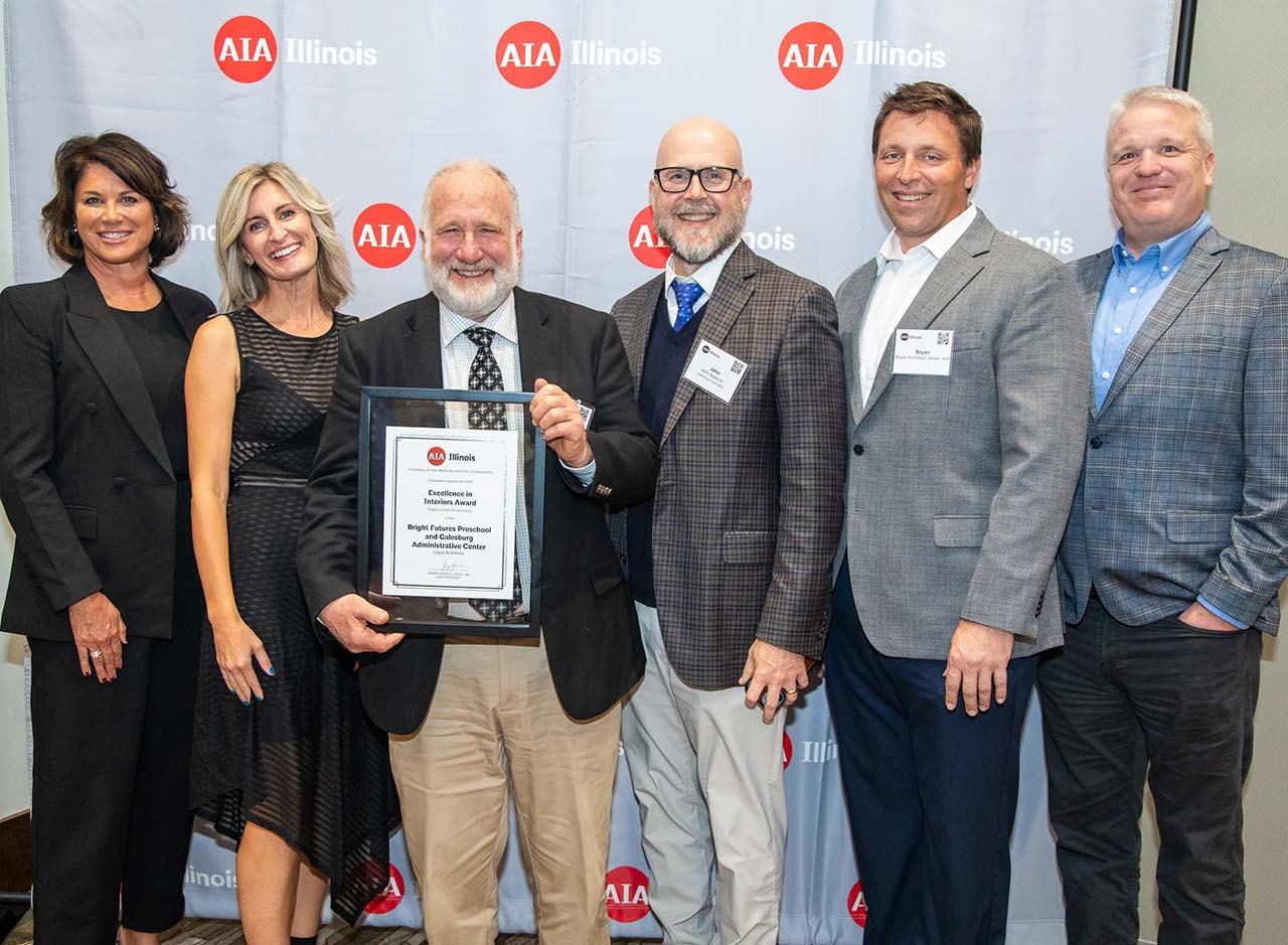 Members of Legat Architects and Galesburg Community Unit School District 205 with award plaque