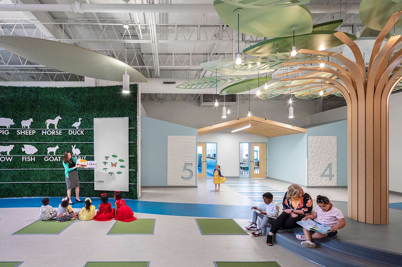 Preschool with green wall and learning tree, classroom entrance