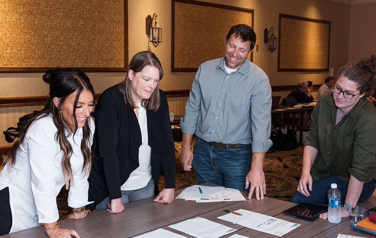 Architect team surrounding documents