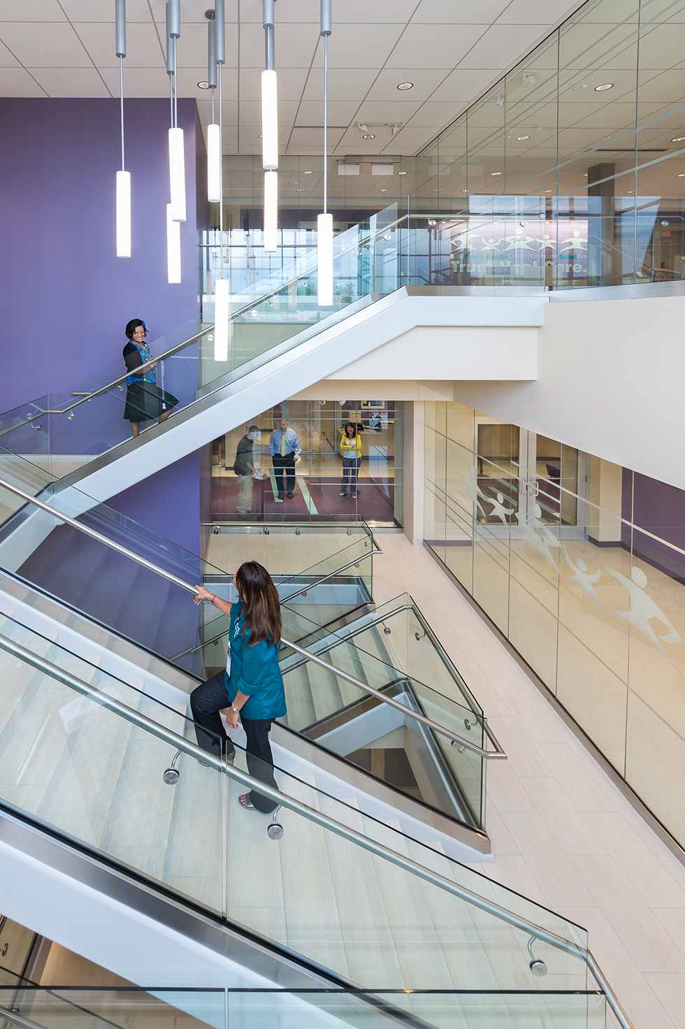 Healthcare medical office building grand staircase with purple and white accents