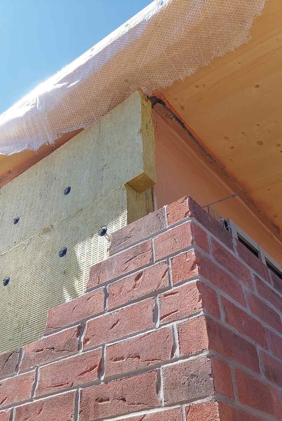 Brick wall showing extra insulation