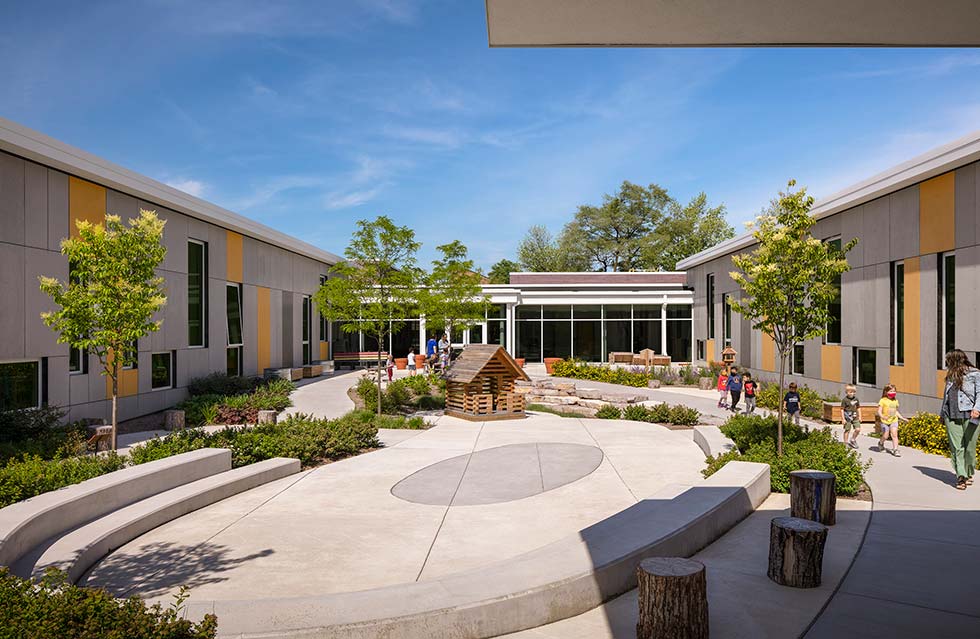 Early learning center courtyard surrounded by colorful building
