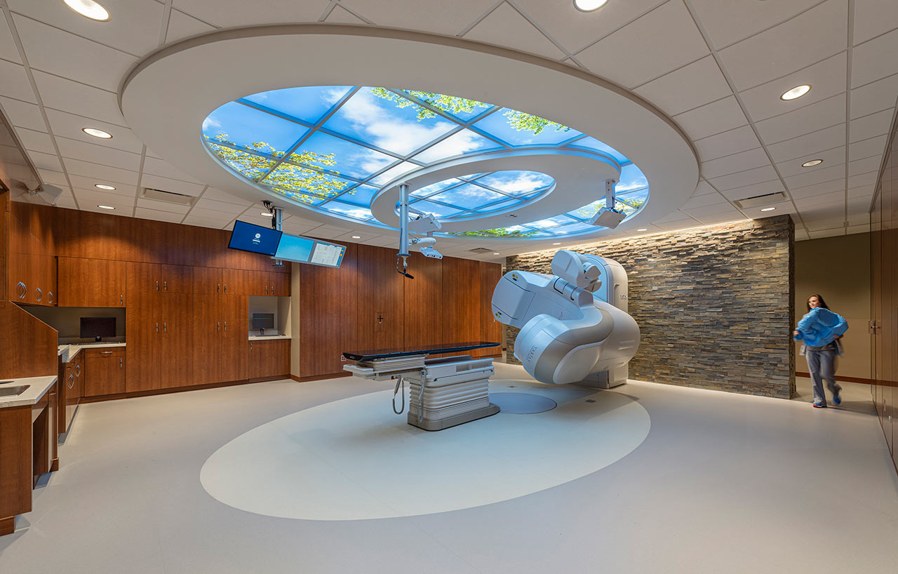 Linear accelerator vault with cloud ceiling and wood/stone walls